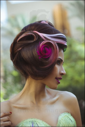 Colorful High Fashion Flowers Hair Style Of A Brunette Female Model