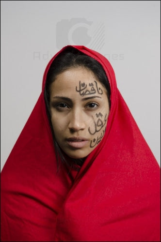 Fierce Arab Woman Looking Into Camera Expressing Pain & Strength Supporting Feminism